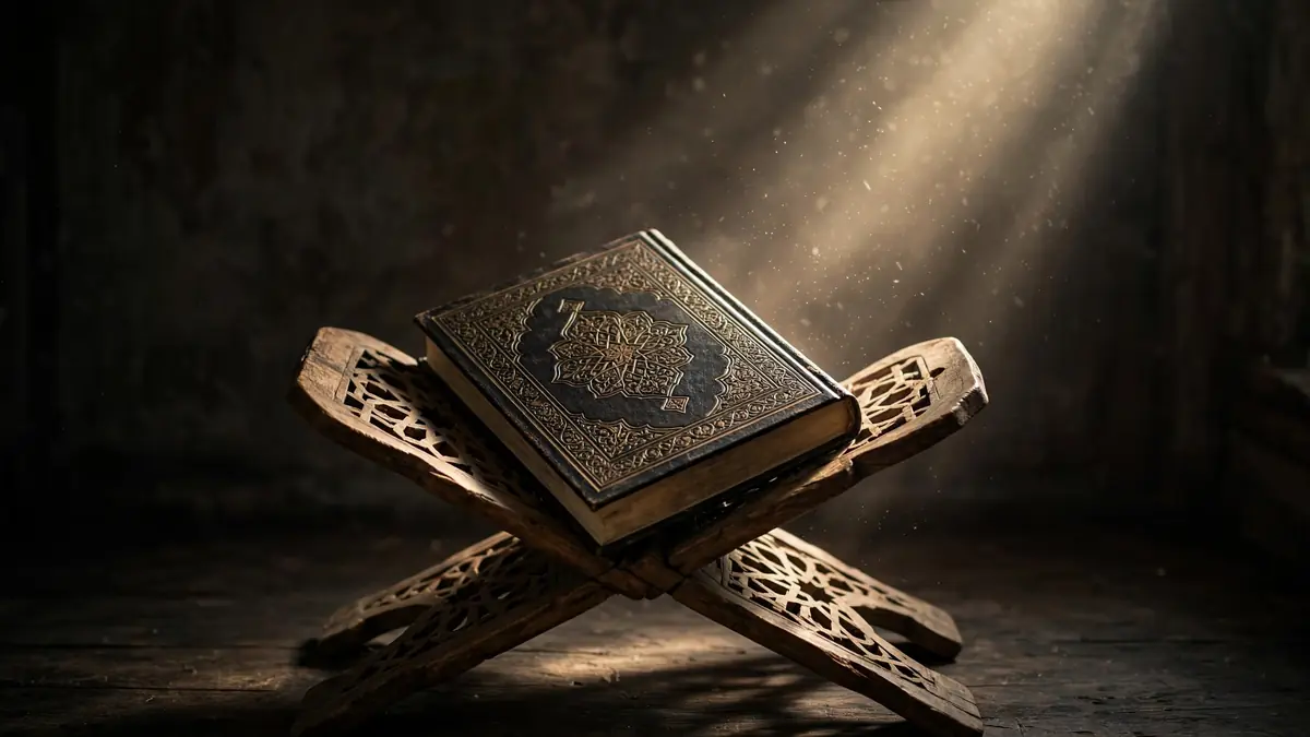 A closed ancient Quran on a wooden rehal stand in a dramatic shaft of light